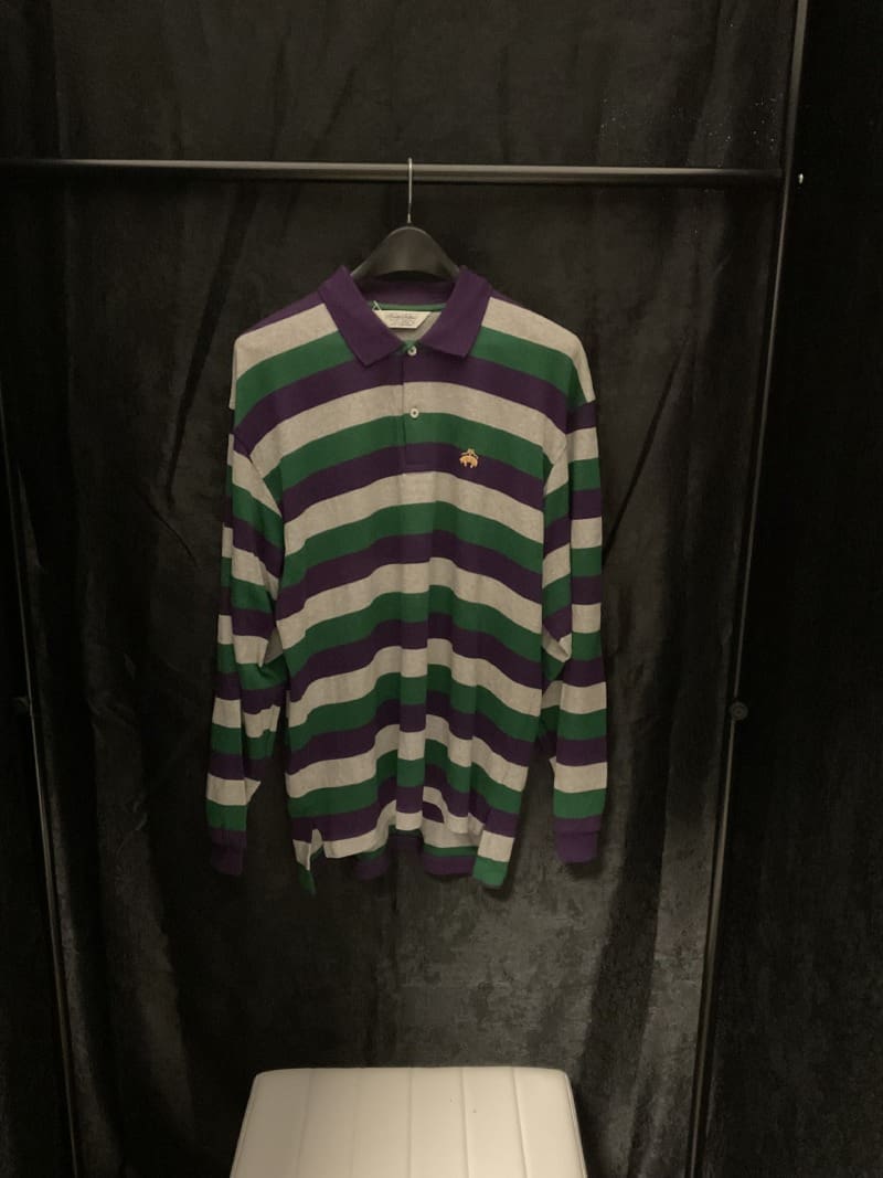 A striped shirt hanging on the wall