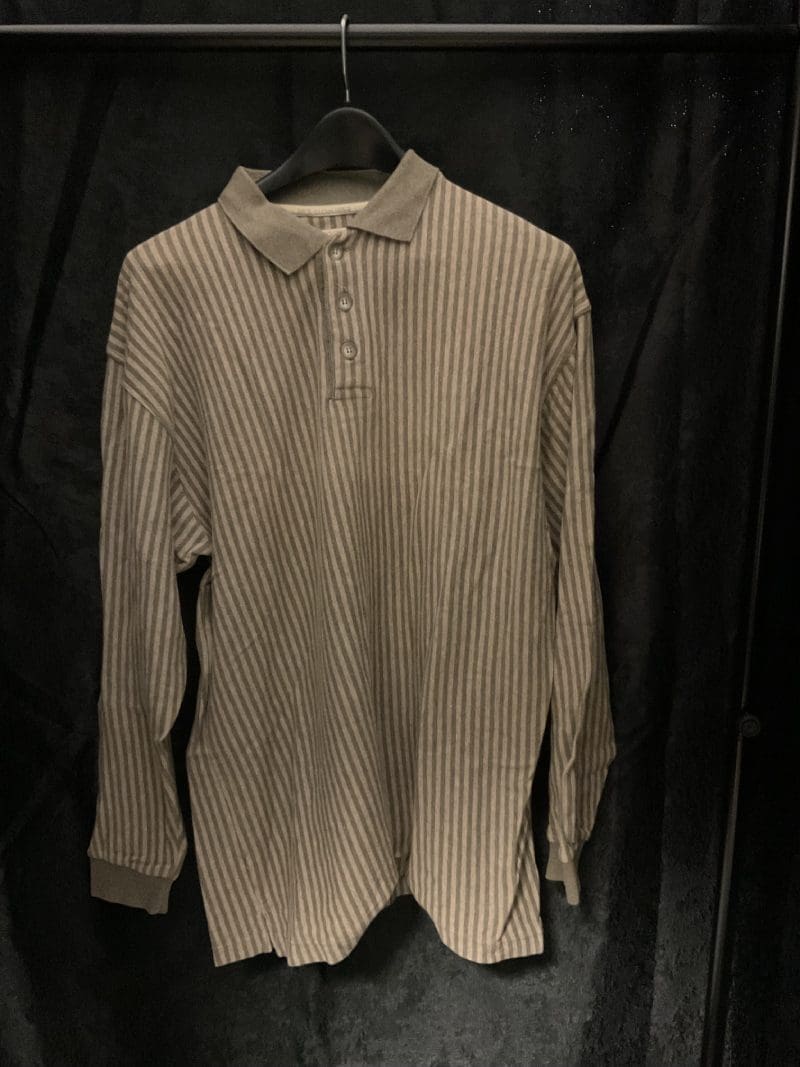 A long sleeve shirt hanging on the wall.