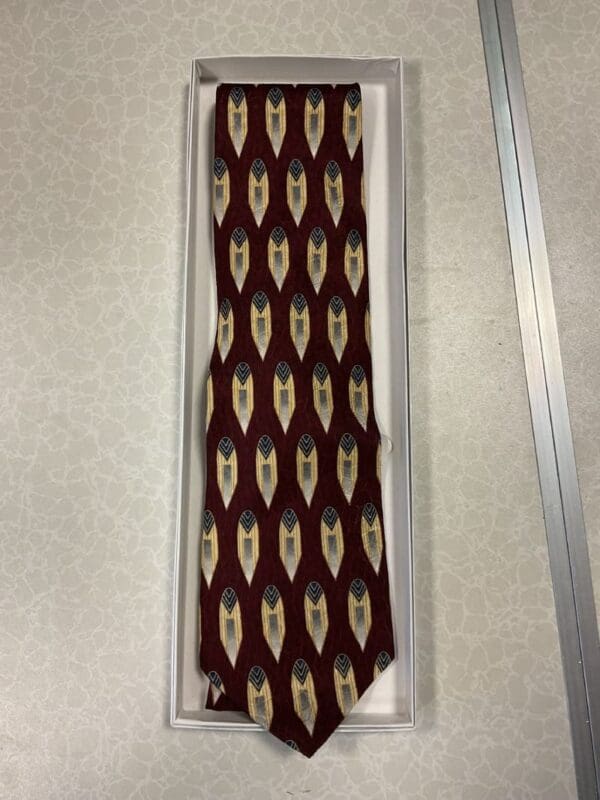 A tie that is hanging on the wall.