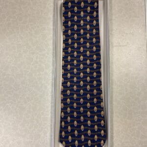 A tie that is in its box.