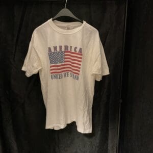 A white shirt with an american flag on it.