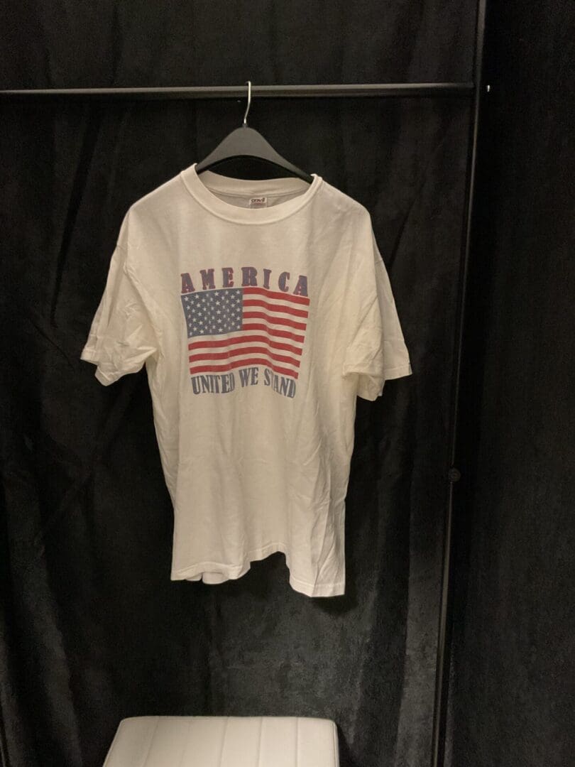 A white shirt with an american flag on it.