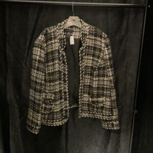 A jacket hanging on a clothes rack.