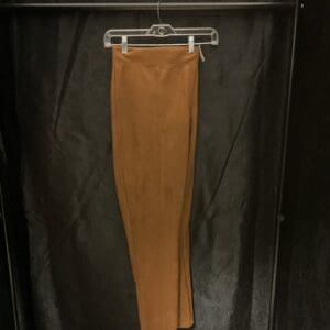 A pair of pants hanging on a rack.