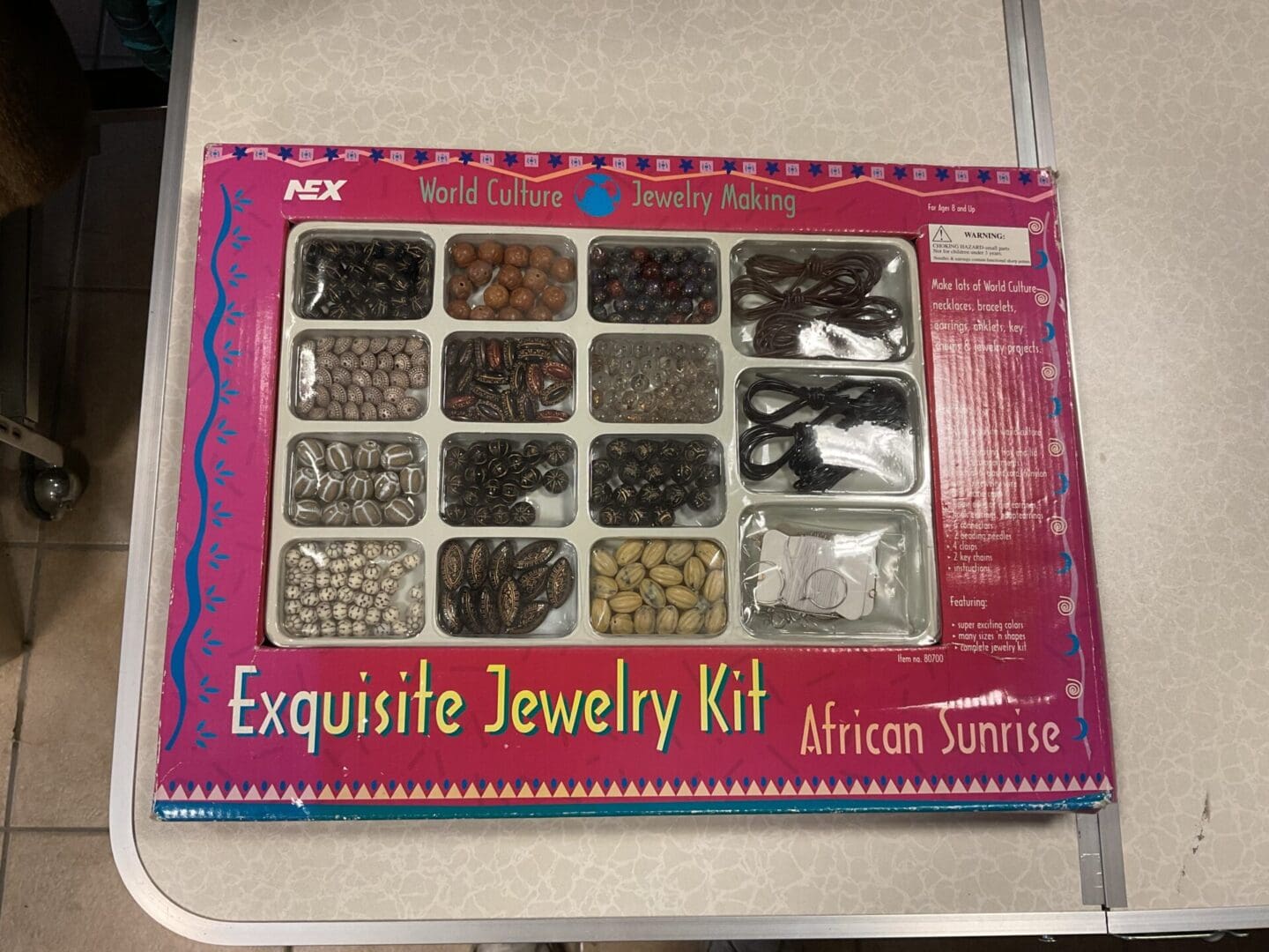 A box of jewelry with various types of beads.