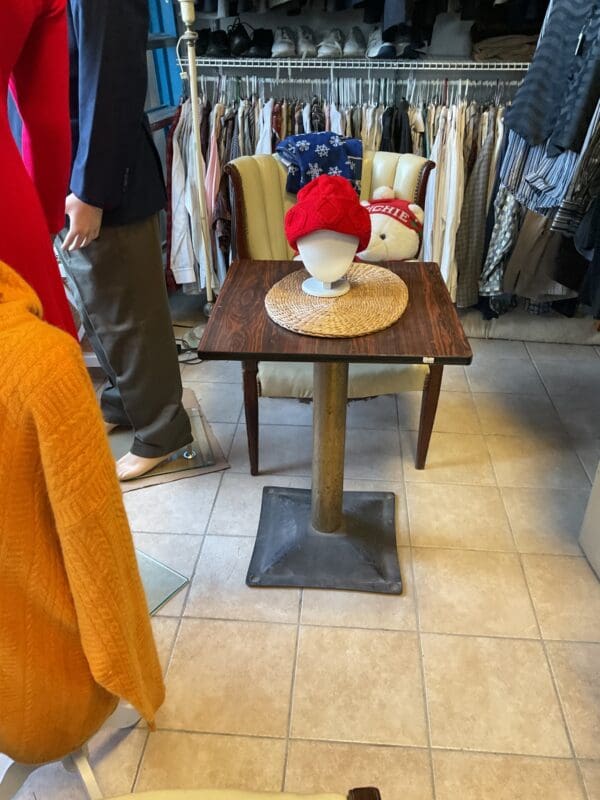 A table with a bowl on top of it