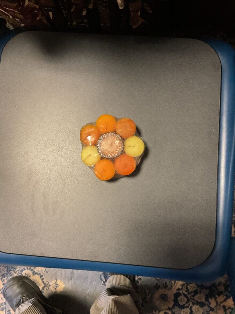 A flower shaped object sitting on top of a table.